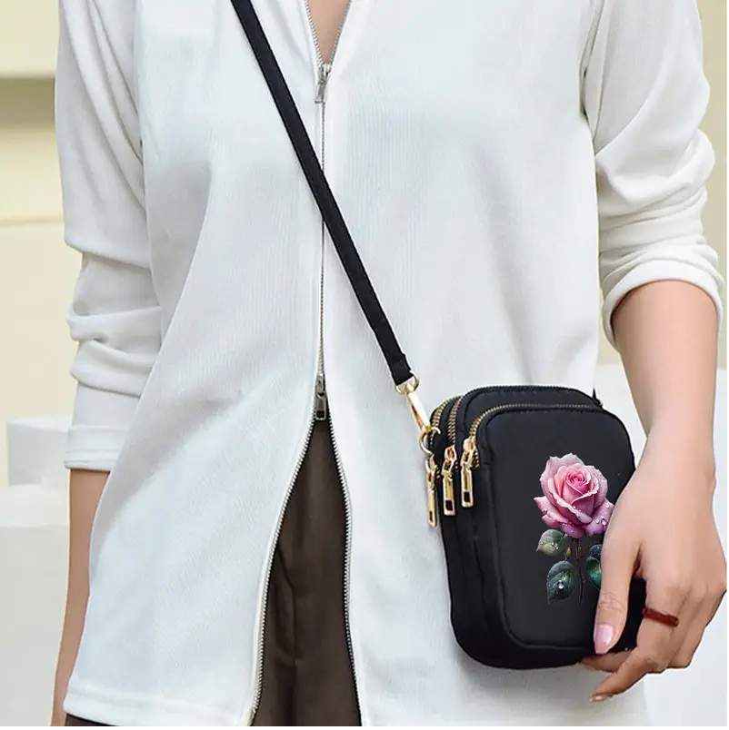 Stylish Black Crossbody Bag with Pink Rose Design