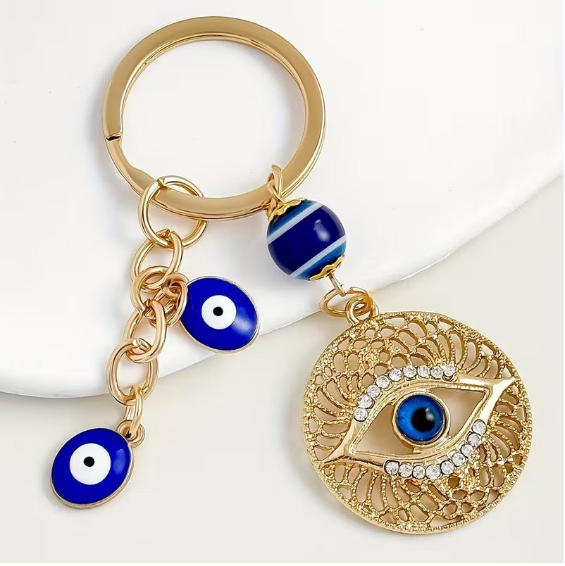 Elegant Blue Eye -Encrusted Keychain with Golden-Tone Chain & Beads -