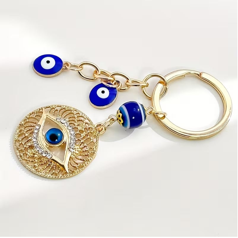 Elegant Blue Eye -Encrusted Keychain with Golden-Tone Chain & Beads -