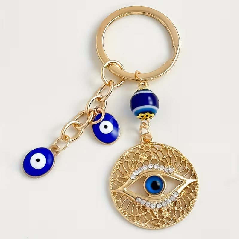 Elegant Blue Eye -Encrusted Keychain with Golden-Tone Chain & Beads -